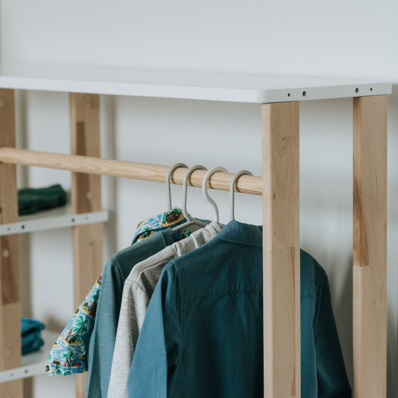 Roomix Montessori wardrobe styled in a bright child’s room, emphasizing simplicity and practical storage
