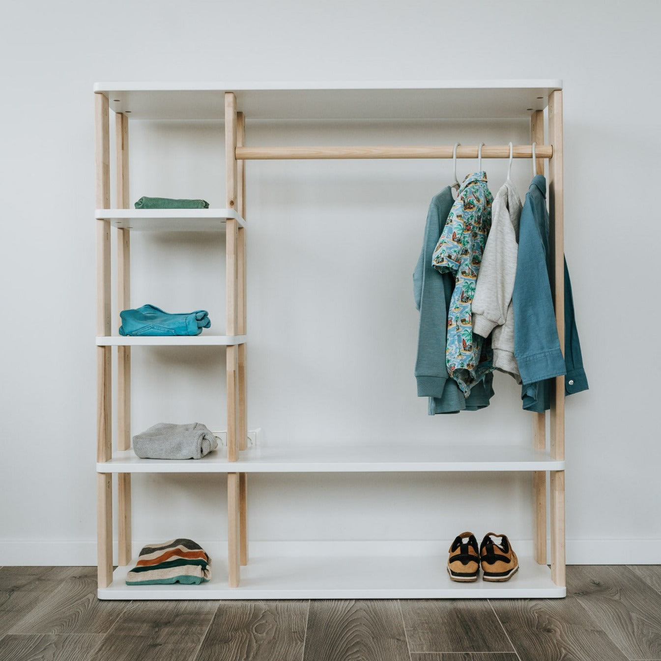 Roomix Montessori wardrobe with hanging rod and shelves, made from natural wood promoting tidy kids’ rooms