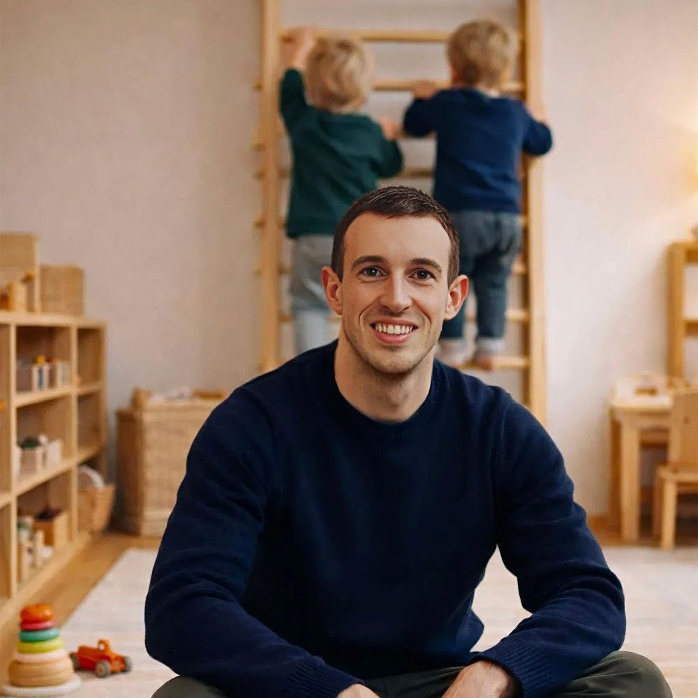 Man sitting on the floor in a room with children playing in the background