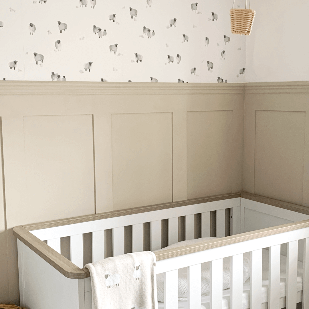 Close-up of Roomix shaker nursery wall panels showing smooth, white-painted wooden panels with clean lines